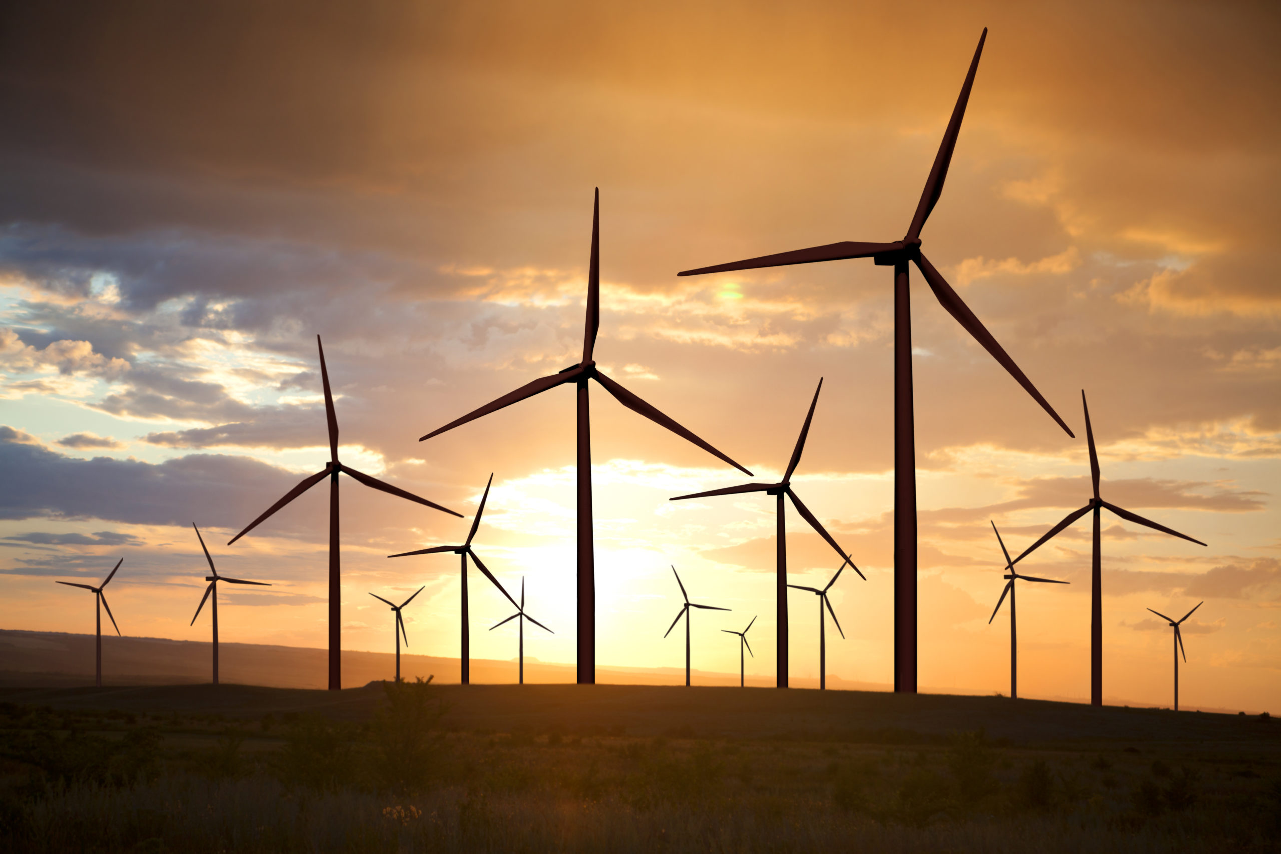 wind turbines on sunset sky